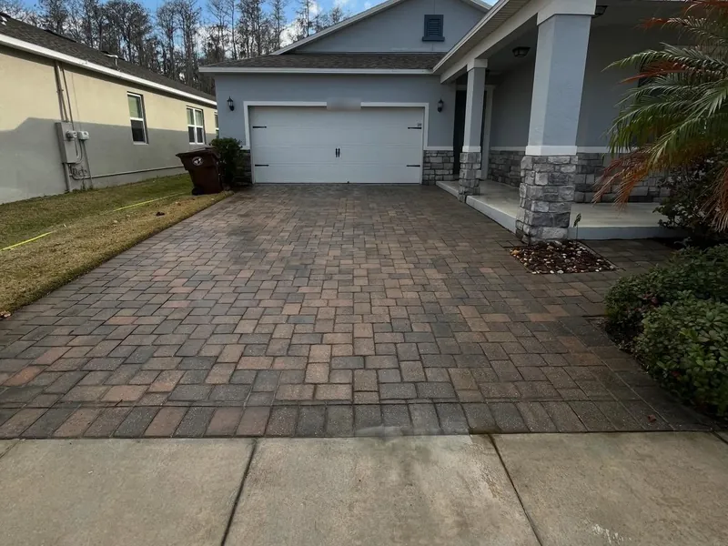 Freshly cleaned paver driveway at a Central Florida home